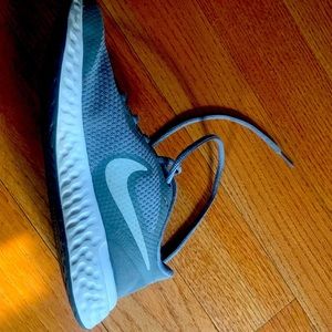 Gray Nike Revolution sneakers size 4Y.